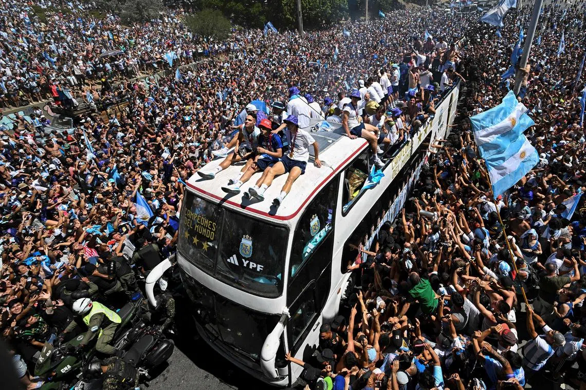 The Argentina World Cup champions are seen on board a bus during their victory parade in Buenos Aires, Argentina, Dec 20, 2022.  Argentina defeated France 4-2 in a penalty shoot-out after a 3-3 draw to win the FIFA World Cup 2022 soccer tournament. 
