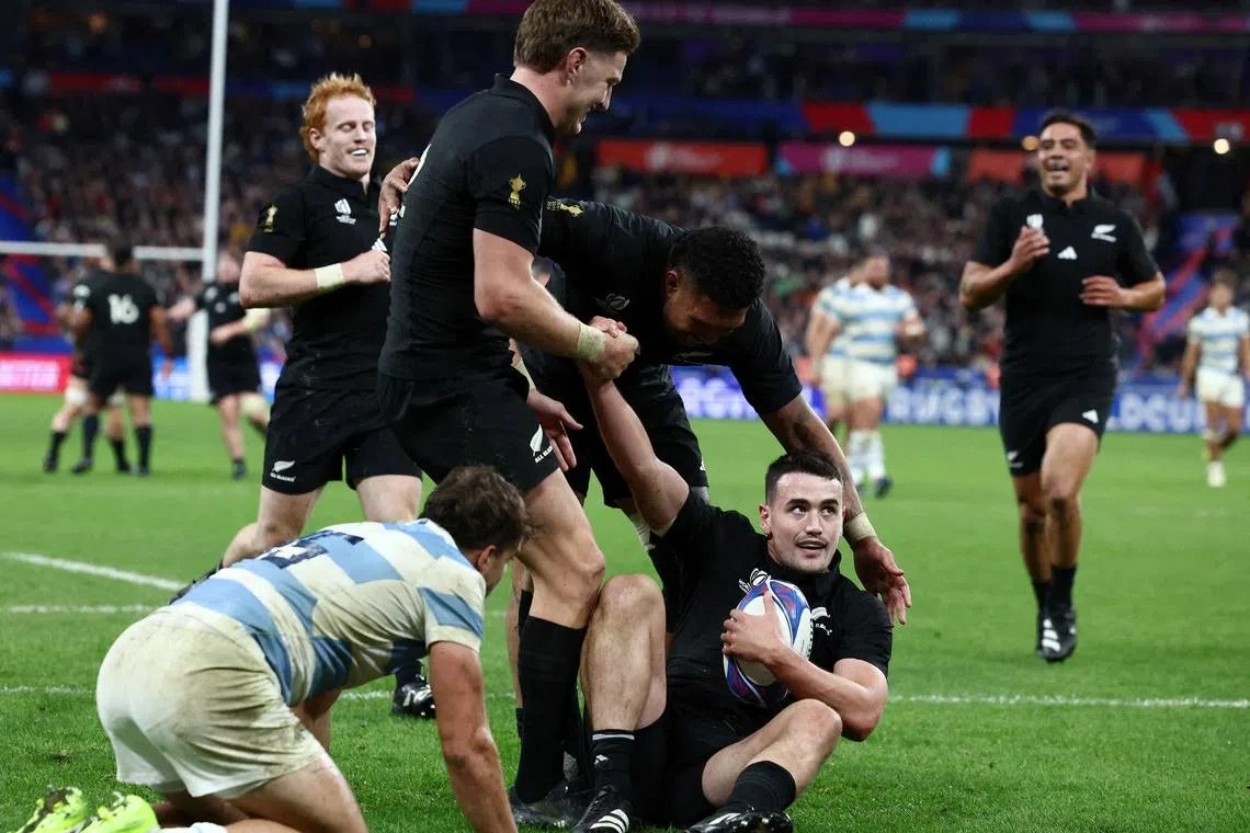 FILE PHOTO: Rugby Union - Rugby World Cup 2023 - Semi Final - Argentina v New Zealand - Stade de France, Saint-Denis, France - October 20, 2023 New Zealand's Will Jordan celebrates scoring their seventh try and completing his hat-trick with teammates REUTERS/Stephanie Lecocq/File Photo