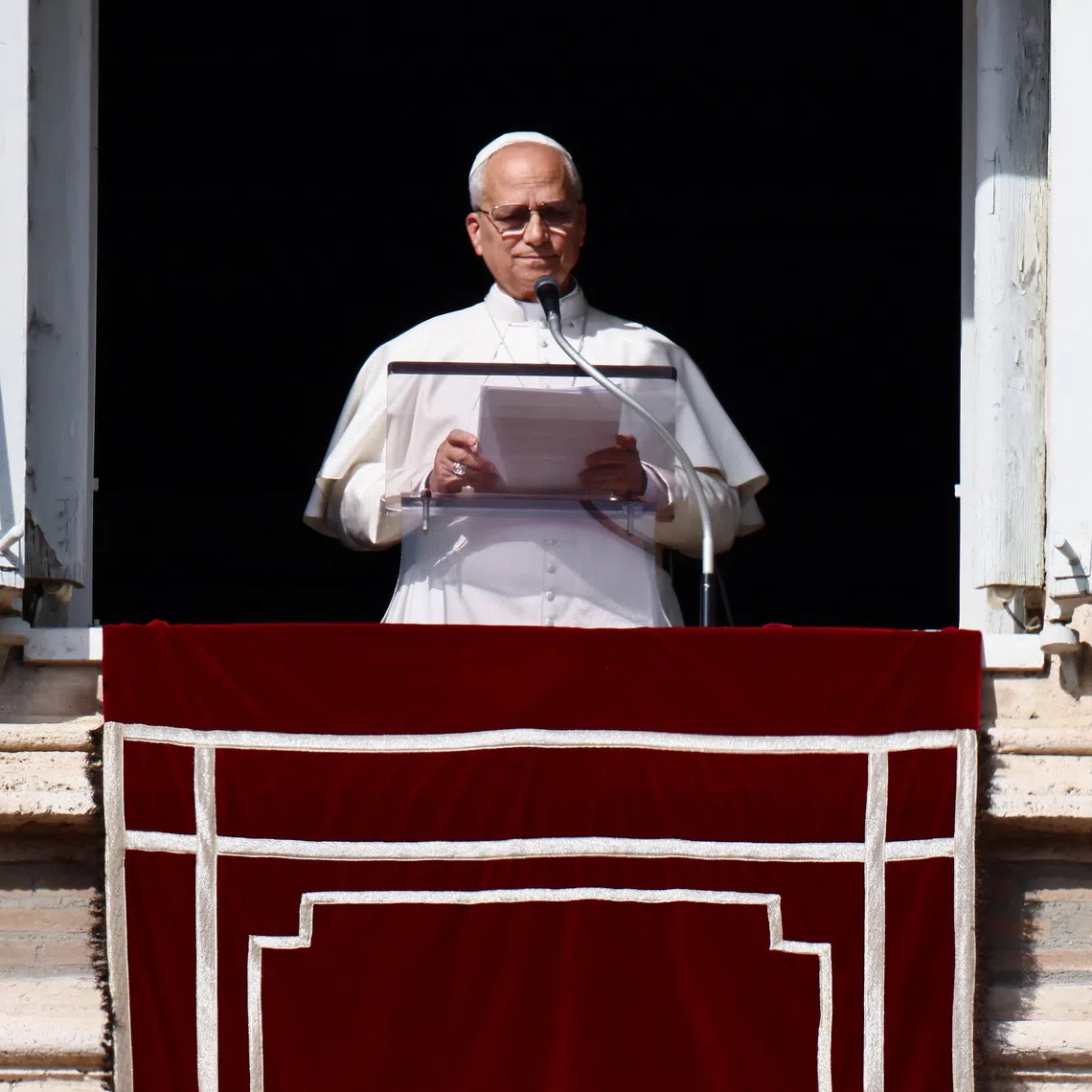Pope Leo XIV leads the Angelus prayer from the window of the Apostolic Palace at the Vatican, November 2, 2025. REUTERS/Vincenzo Livieri