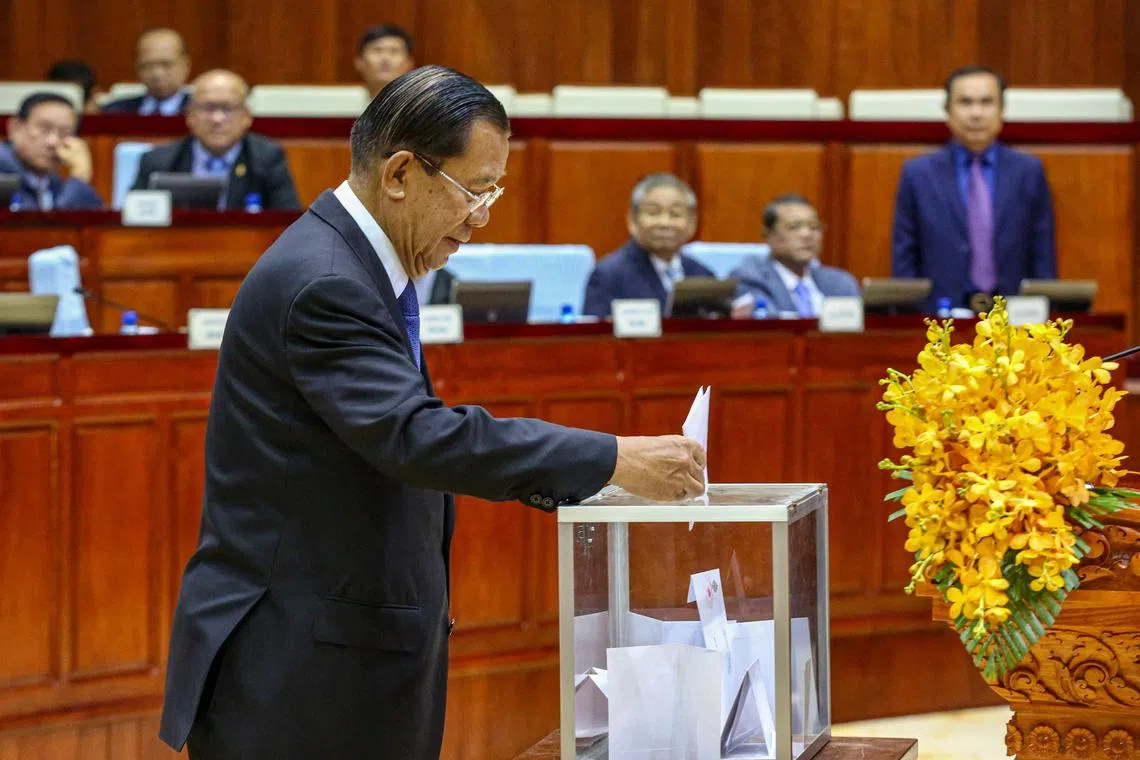 Former Cambodia PM Hun Sen voting during a meeting at the National Assembly building in Phnom Penh on Feb 21, 2024. 