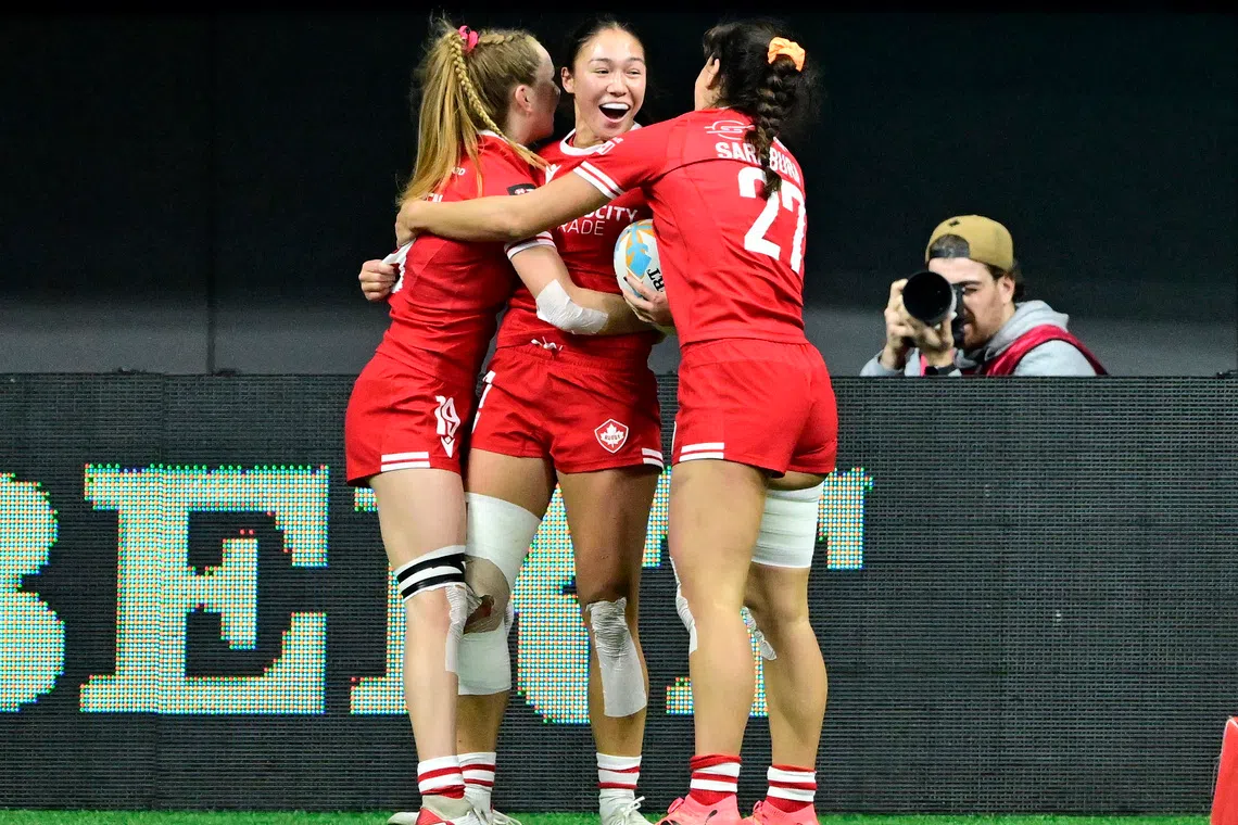 FILE PHOTO: Rugby Union - HSBC Sevens - Canada v United States - Women's 7th Place Play-Off - Vancouver - BC Place, Vancouver, Canada - February 23, 2025 Canada's Olivia Sarabura celebrates with Shalaya Valenzuela after scoring a try REUTERS/Jennifer Gauthier/File Photo