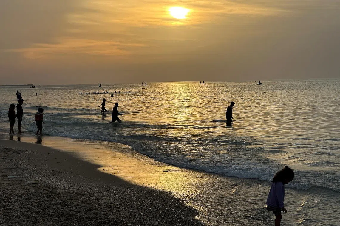 Palestinians spending time on a beach during a temporary truce between Hamas and Israel, in Deir al-Balah in the central Gaza Strip Nov 25, 2023. 