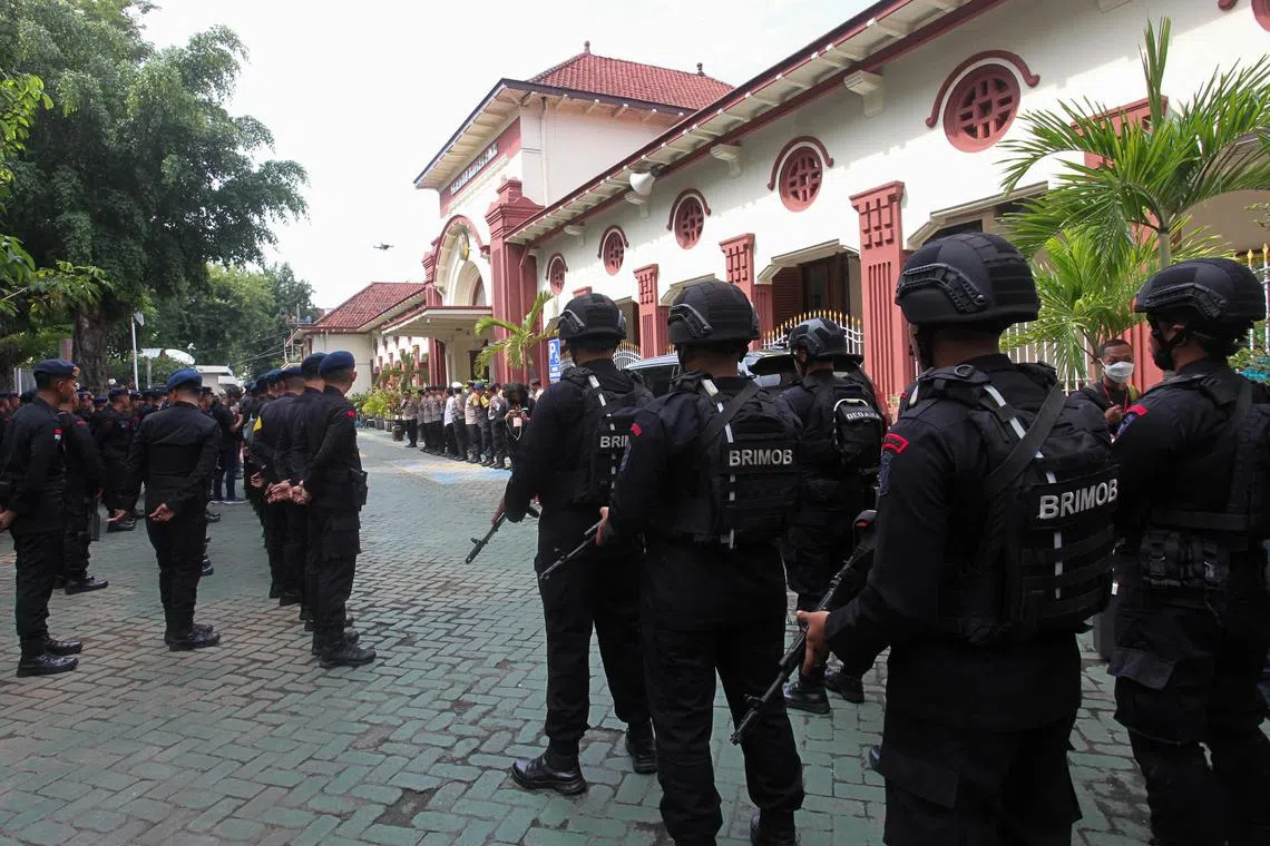 Mobile brigade police personnel take part in a briefing ceremony at the Surabaya court ahead of the first trial over a soccer stampede in East Java that killed 135 people in October 2022, in Surabaya, East Java province, Indonesia, January 16, 2023, in this photo taken by Antara Foto. Antara Foto/Didik Suhartono/ via REUTERS ATTENTION EDITORS - THIS IMAGE HAS BEEN SUPPLIED BY A THIRD PARTY. MANDATORY CREDIT. INDONESIA OUT. NO COMMERCIAL OR EDITORIAL SALES IN INDONESIA.