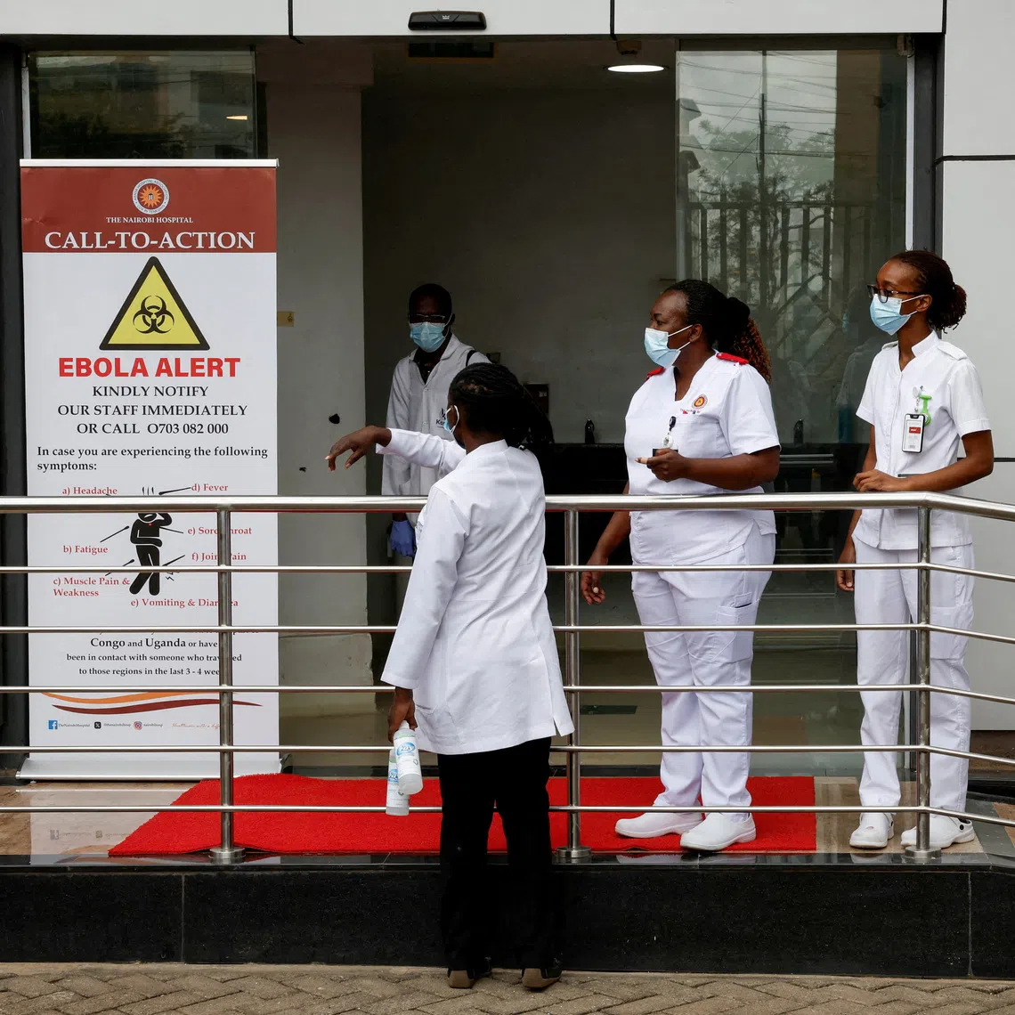 Staff members work at Nairobi Hospital where an Ebola patient was isolated immediately upon arrival and treated at the hospital's physically separate East Wing Isolation Facility, but later died, in Nairobi, Kenya October 7, 2026. REUTERS/Monicah Mwangi
