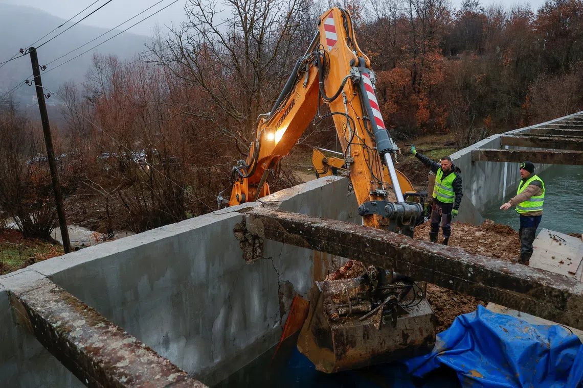 Workers repair the damaged canal in northern Kosovo, supplying water to two coal-fired power plants that generate nearly all of the country's electricity, in Varage, near Zubin Potok, Kosovo November 30, 2024. REUTERS/Valdrin Xhemaj