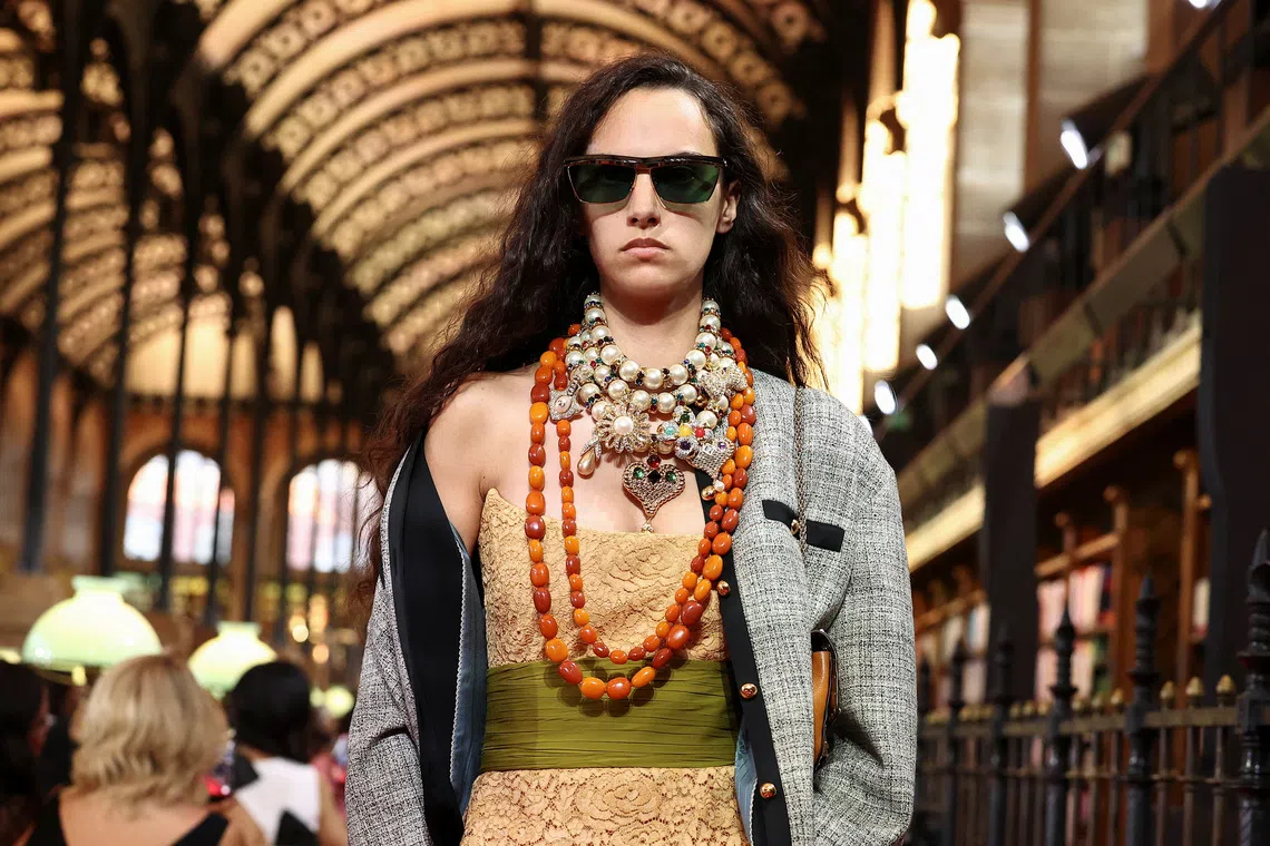 A model presents a creation by designer Alessandro Michele as part of his Spring/Summer 2027 collection show for fashion house Valentino during Paris Fashion Week in Paris, France, on Oct 4.