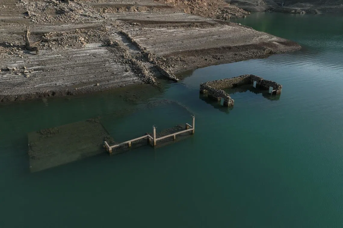 A drone view shows the reappearing remains of buildings of the village of Kallio in Lake Mornos, Greece.