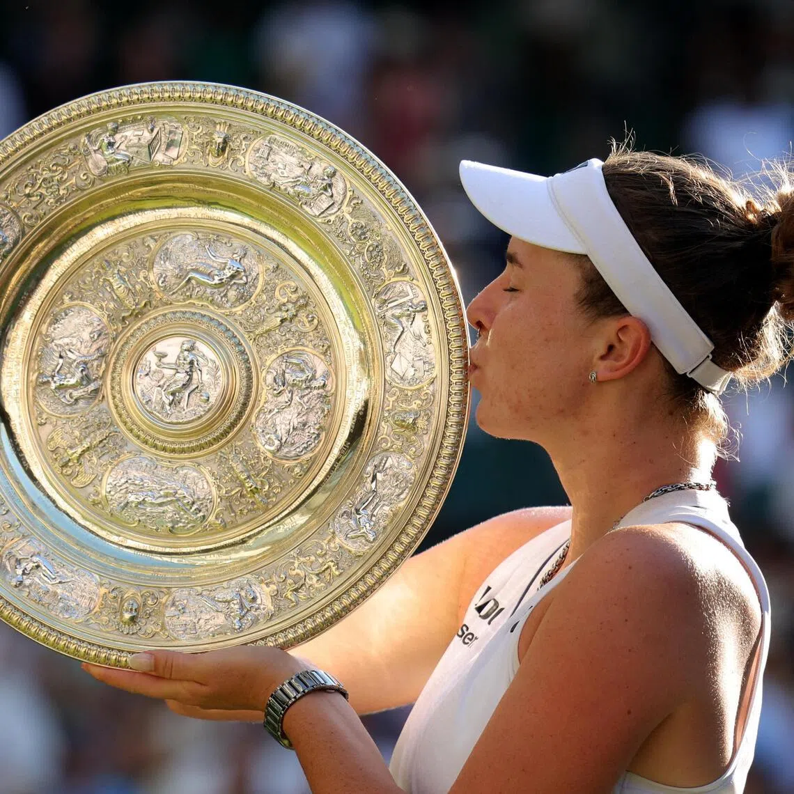 Linda Noskova of the Czech Republic celebrates with the trophy after winning her Wimbledon final against compatriot Karolina Muchova.