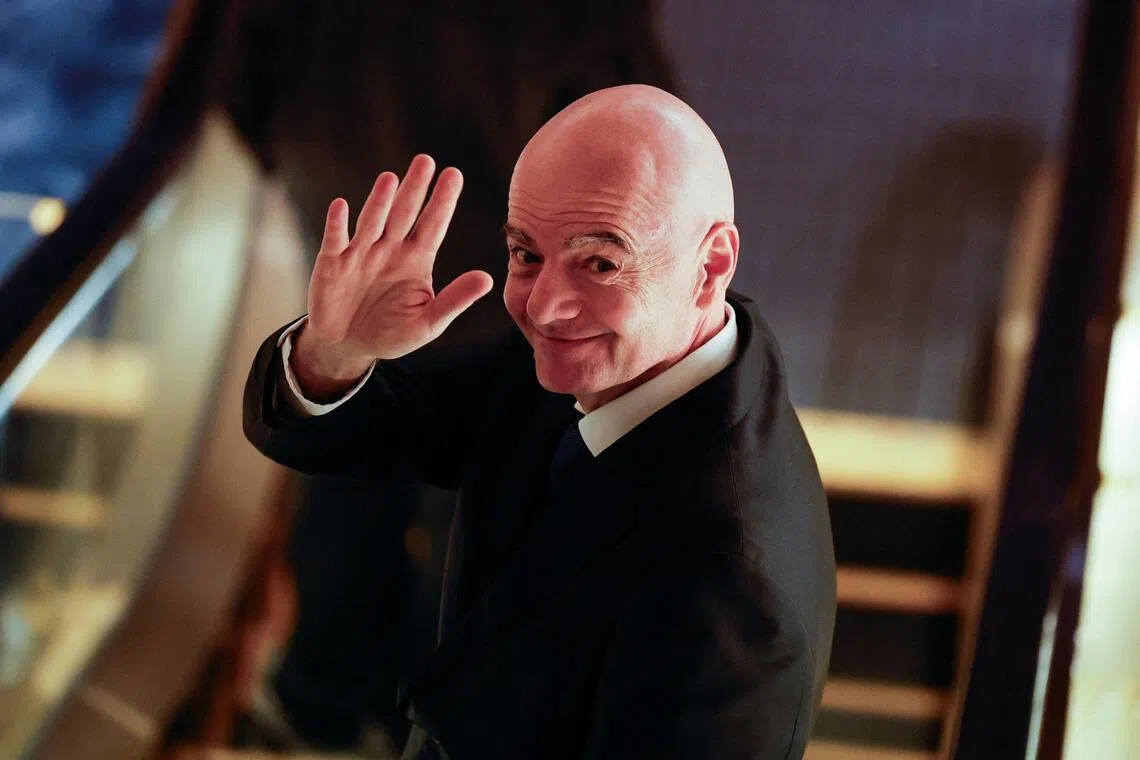 FIFA president Gianni Infantino gesturing to reporters as he heads to the Asian Football Confederation’s extraordinary congress in Tokyo, Japan, on Oct 23.