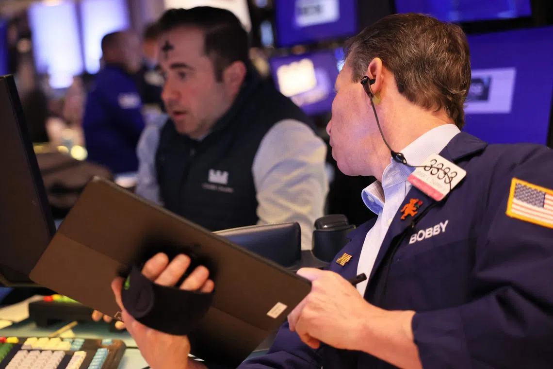 Traders work on the floor of the New York Stock Exchange.