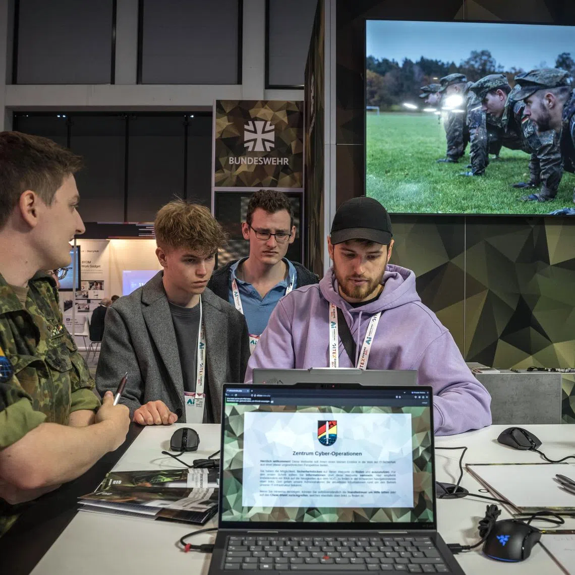 A German Army recruitment booth during a tech trade show in Berlin on May 23, 2025. In a recent survey, only 17 percent of Germans said they would defend their country if attacked. (Sergey Ponomarev/The New York Times)