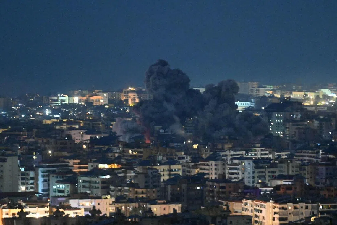 Fire blazes and black smoke rises from the site of an Israeli airstrike that targeted the office of the Hezbollah affiliated Al-Manar TV station in Beirut’s southern suburb of Haret Hreik on March 3, 2026.  