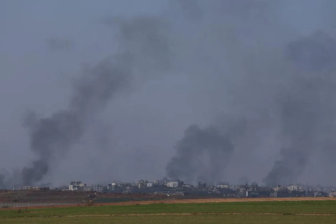 Smoke rises over Gaza, amid the ongoing conflict between Israel and the Palestinian Islamist group Hamas, as seen from southern Israel, December 25, 2023. REUTERS/Violeta Santos Moura