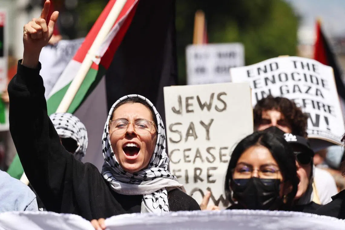 LOS ANGELES, CALIFORNIA - APRIL 15: Pro-Palestinian demonstrators march during a 'Strike for Gaza' protest, calling for a permanent ceasefire in the war in Gaza on April 15, 2024 in Los Angeles, California. Pro-Palestinian protestors blocked traffic in some major U.S. cities today coinciding with Tax Day.   Mario Tama/Getty Images/AFP (Photo by MARIO TAMA / GETTY IMAGES NORTH AMERICA / Getty Images via AFP)