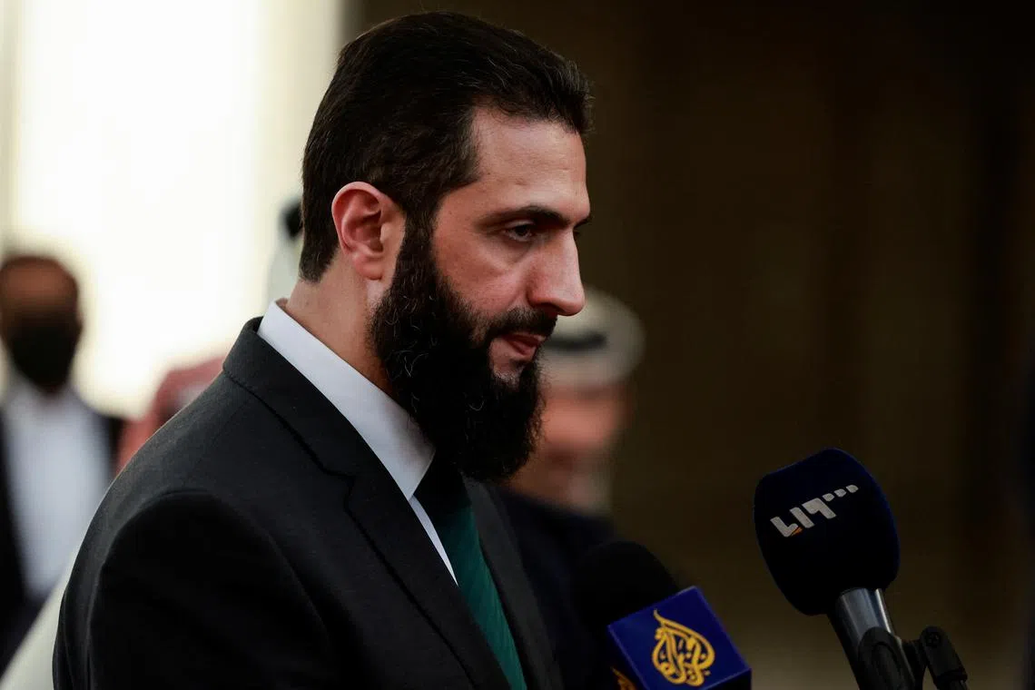 Syria's de facto leader Ahmed al-Sharaa, also known as Abu Mohammed al-Golani, speaks to the media on the day he meets with Qatar's Minister of State Mohammed bin Abdulaziz Al-Khulaifi, after the ousting of Syria's Bashar al-Assad, in Damascus, Syria, December 23, 2024. REUTERS/Ammar Awad/File Photo