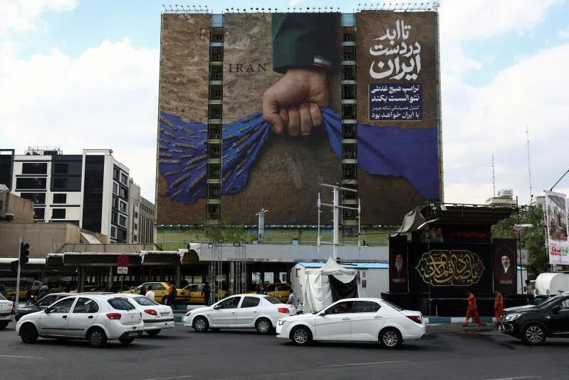 A billboard declaring the Strait of Hormuz belonging to Iran on a building in Tehran, on April 13, 2026.
