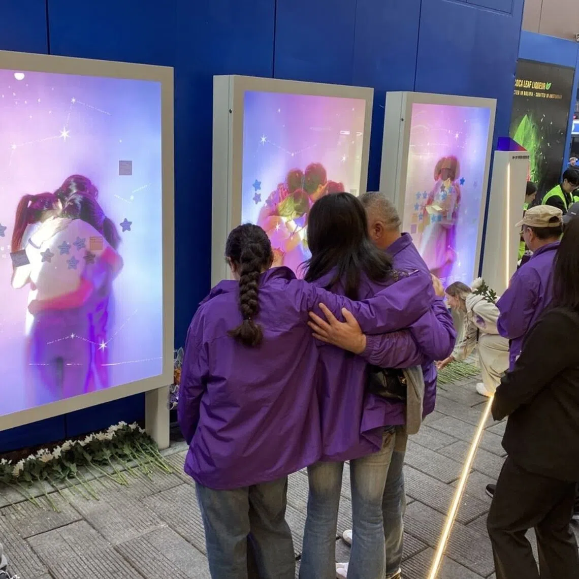 Family members of Grace Rashed, an Australian who died in the 2022 Itaewon crowd crush, in front of a memorial site for the disaster on Oct 24.