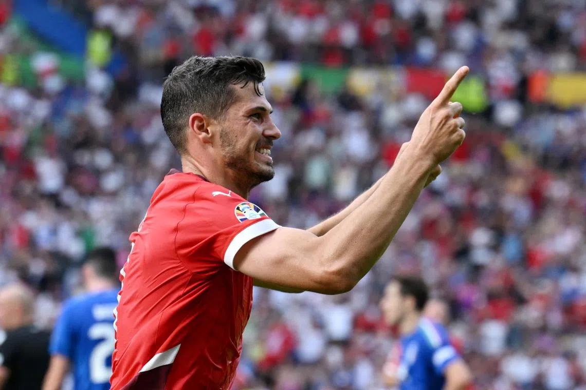Soccer Football - Euro 2024 - Round of 16 - Switzerland v Italy - Berlin Olympiastadion, Berlin, Germany - June 29, 2024  Switzerland's Remo Freuler celebrates scoring their first goal REUTERS/Annegret Hilse