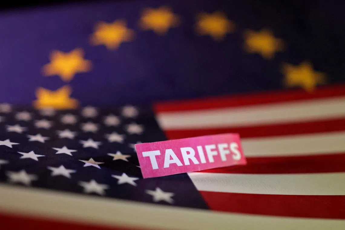 FILE PHOTO: U.S. and European Union flags and a \"tariffs\" label are seen in this illustration taken April 10, 2025. REUTERS/Dado Ruvic/Illustration/File Photo