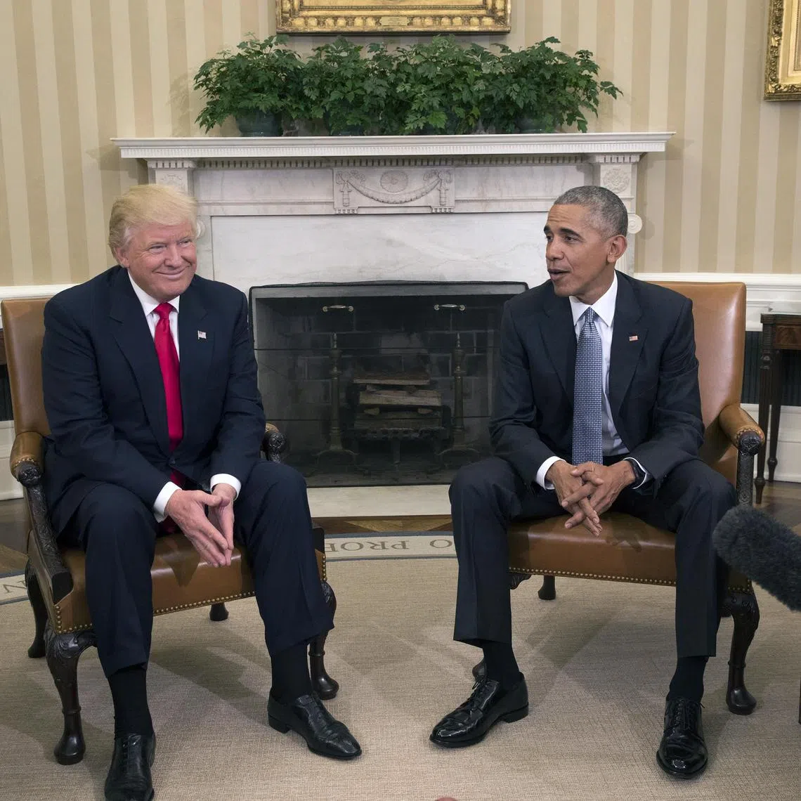 A 2016 photo shows then president Barack Obama (right) meeting president-elect Donald Trump at the White House.