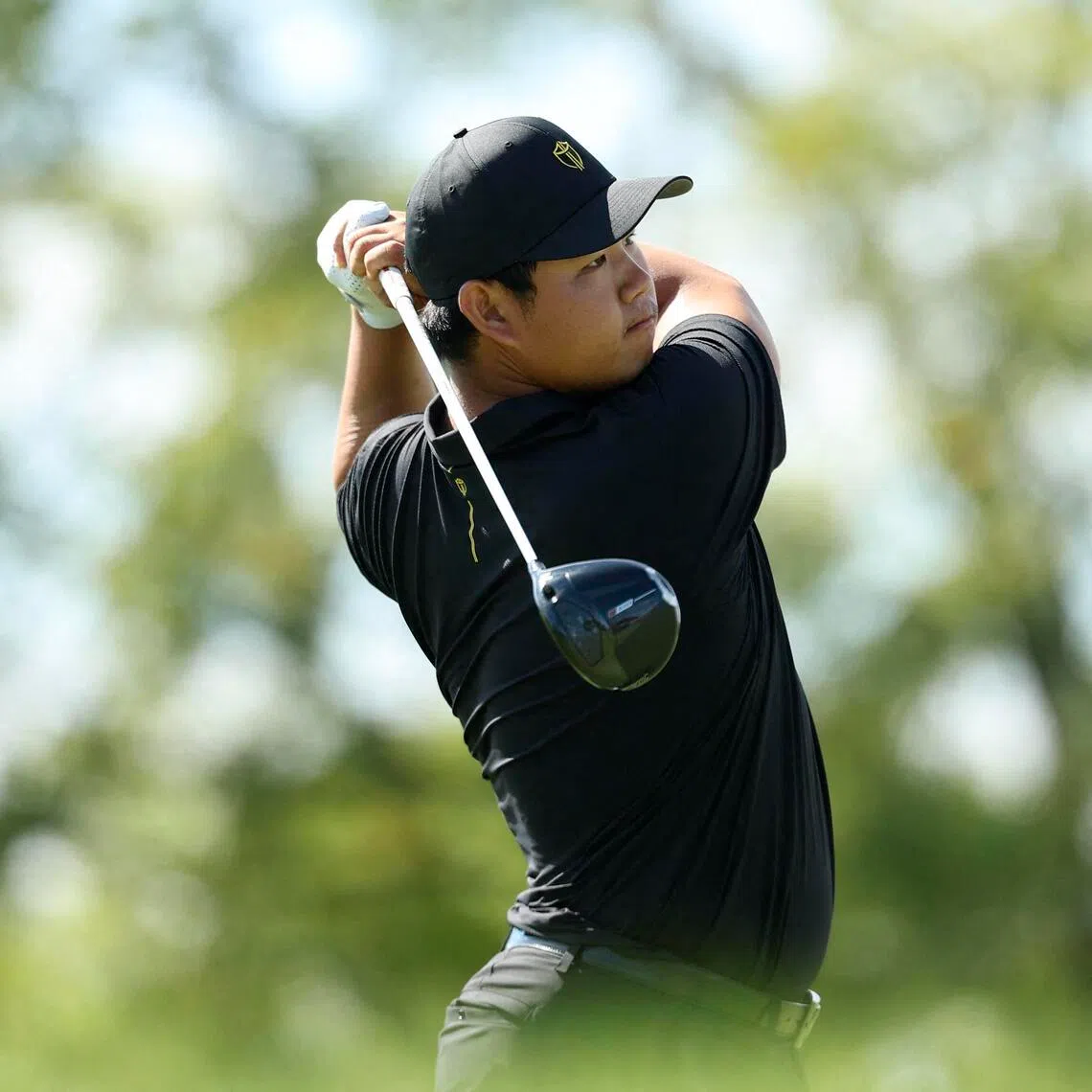 Tom Kim, seen here at the Presidents Cup, shot a three-under 67 for a share of seventh on his Asian Games debut.