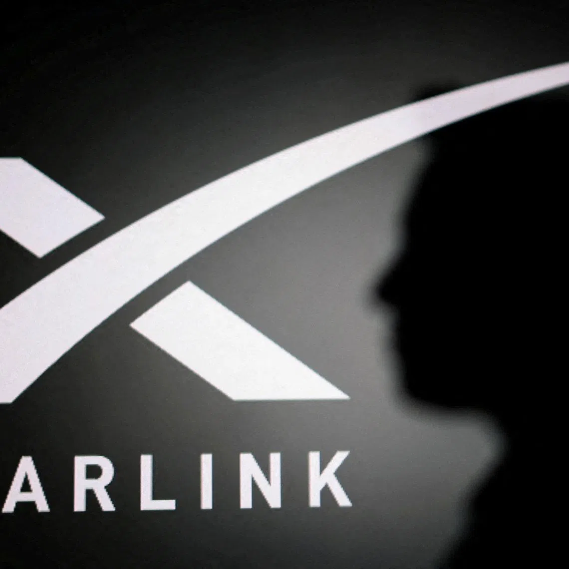 FILE PHOTO: The silhouette of Elon Musk and Starlink logo are seen in this illustration taken June 11, 2026. REUTERS/Dado Ruvic/Illustration/File Photo