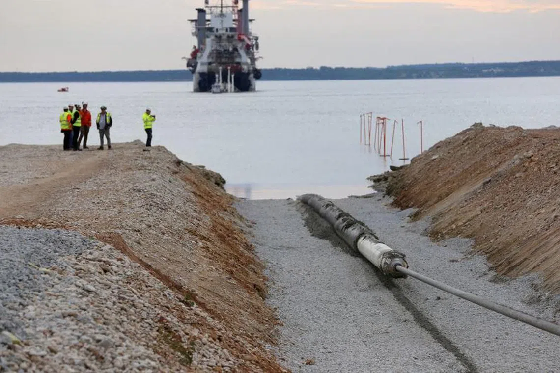 FILE PHOTO: A view of the Balticconector pipeline as it is pulled into the sea in Paldiski, Estonia in an undated handout photo taken in 2019. ELERING/Handout via REUTERS//File Photo