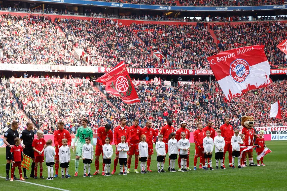 FILE PHOTO: Soccer Football - Bundesliga - Bayern Munich v 1. FC Union Berlin - Allianz Arena, Munich, Germany - March 21, 2026 Bayern Munich players line up with young mascots before the match REUTERS/Michaela Stache/ File Photo
