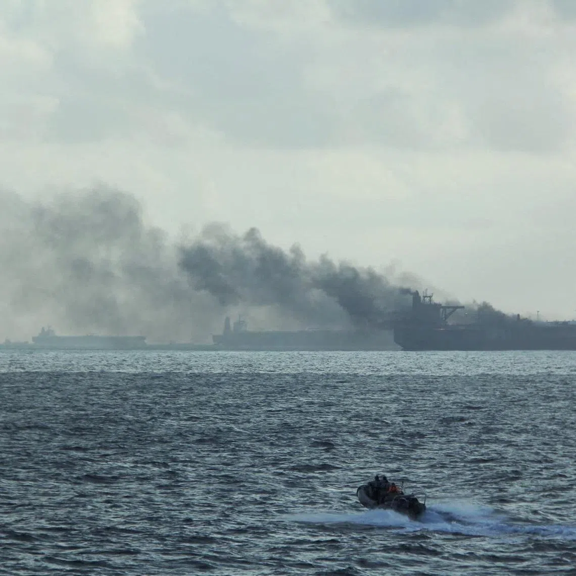 FILE PHOTO: A handout image shows the RSS Supreme's rigid-hulled inflatable boat in the vicinity of the burning vessels following a fire on two oil tankers about 55 km (34 miles) northeast of the Singaporean island of Pedra Branca, July 19, 2024. Republic of Singapore Navy/Handout via REUTERS/File Photo