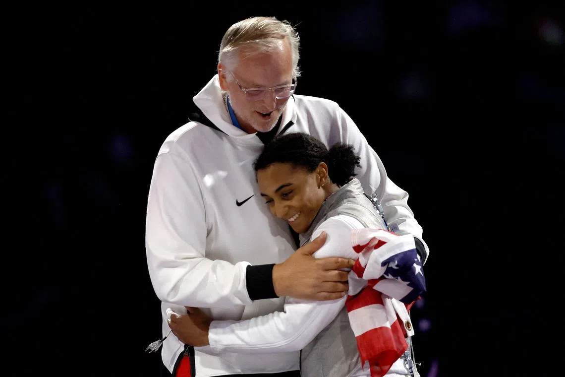 FILE PHOTO: Paris 2024 Olympics - Fencing - Women's Foil Individual Gold Medal Bout - Grand Palais, Paris, France - July 28, 2024. Lauren Scruggs of United States reacts after losing her gold medal bout against Lee Kiefer of United States. REUTERS/Albert Gea/File Photo