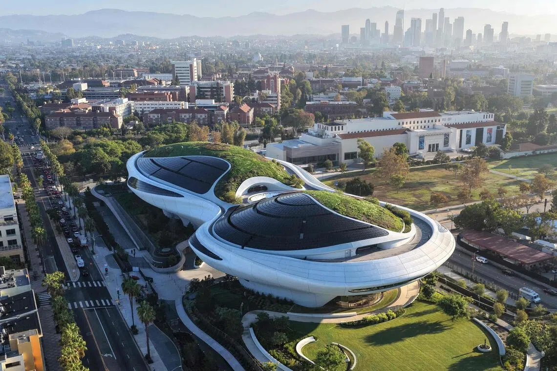 The museum’s unusual design – a green roof that blends into the surrounding landscape – is meant to offer a glimpse of the future and spark visitors’ curiosity.