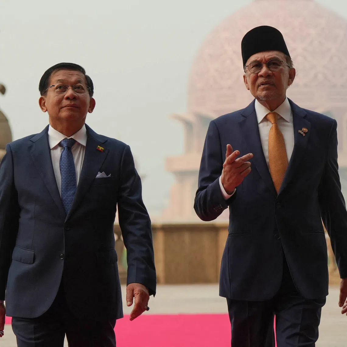 Myanmar’s President Min Aung Hlaing (left) walking with Malaysia’s Prime Minister Anwar Ibrahim in Putrajaya on Oct 8.