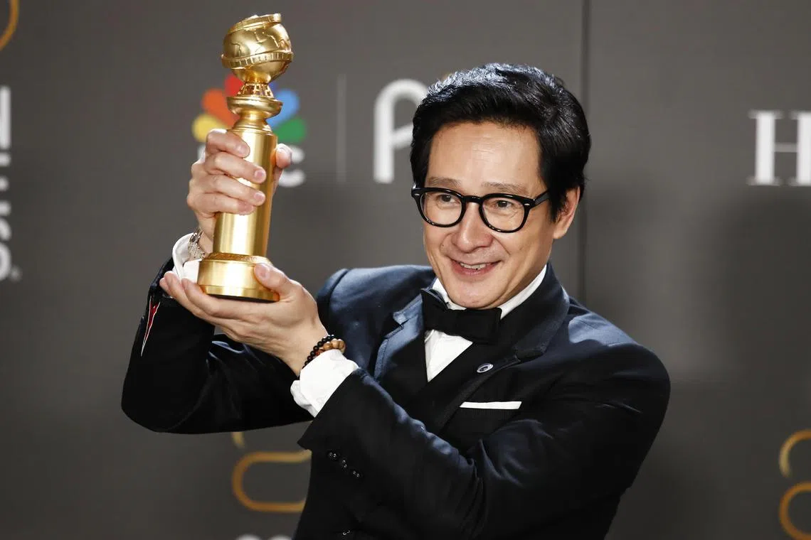 Vietnamese-American actor Ke Huy Quan poses with the award for Best Supporting Actor in a Motion Picture in the press room during the 80th annual Golden Globe Awards ceremony in Beverly Hills, California, on Jan 10, 2023. 