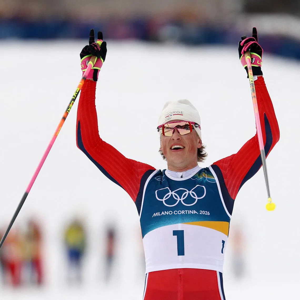 Johannes Klaebo of Norway celebrating after winning gold in the men's 50km mass start classic cross-country race at the 2026 Milano-Cortina Winter Olympics on Feb 21.  This is his record sixth gold of the Games.