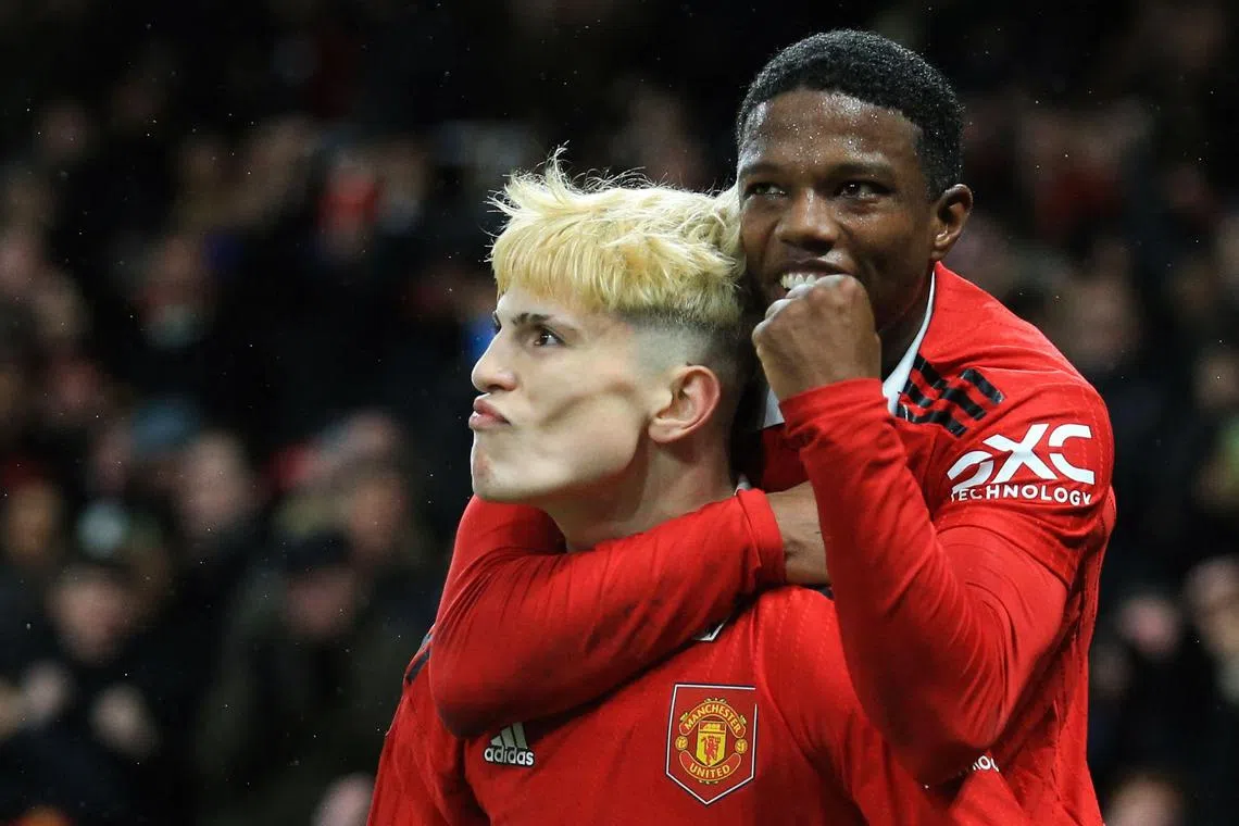Manchester United's Argentinian midfielder Alejandro Garnacho (left) celebrates after scoring his team second goal.