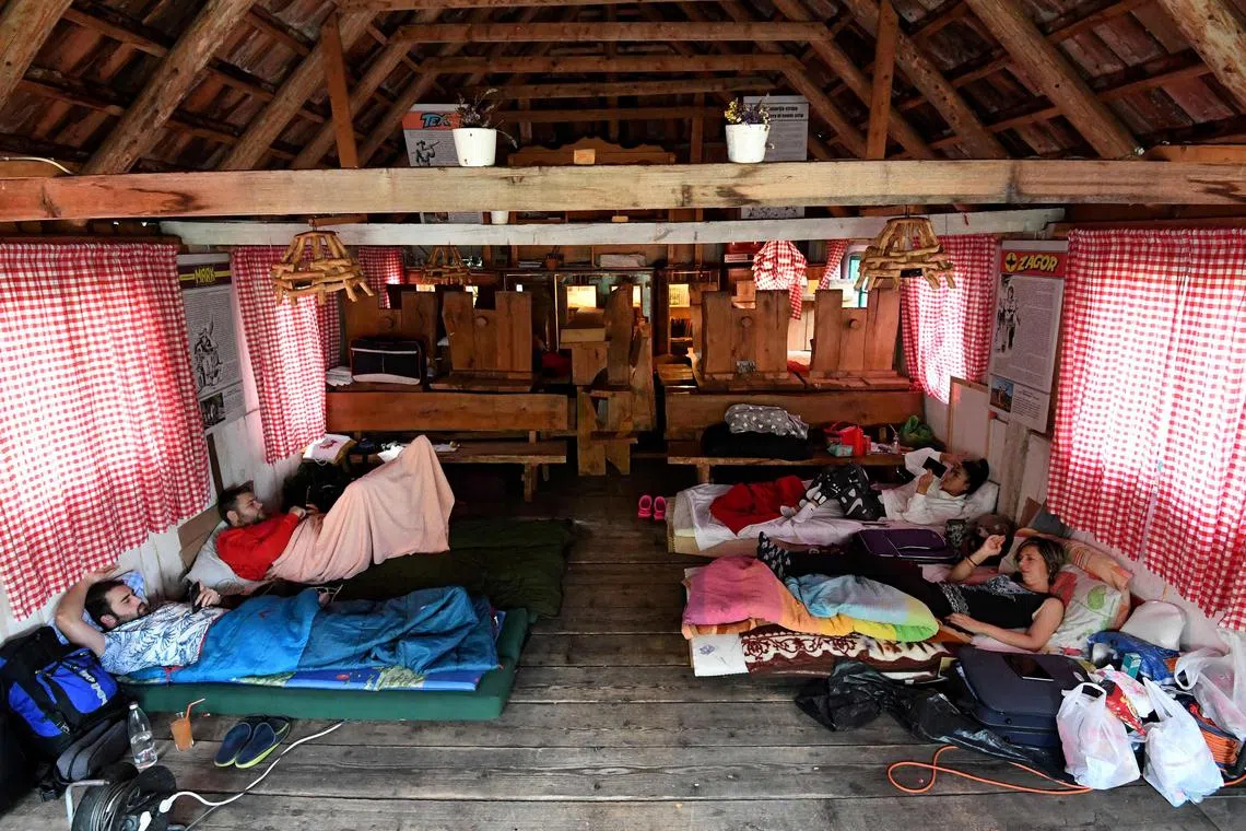 Attendees take part in the annual "lie in" competition on Sept 20 in Brezna, northern Montenegro. 