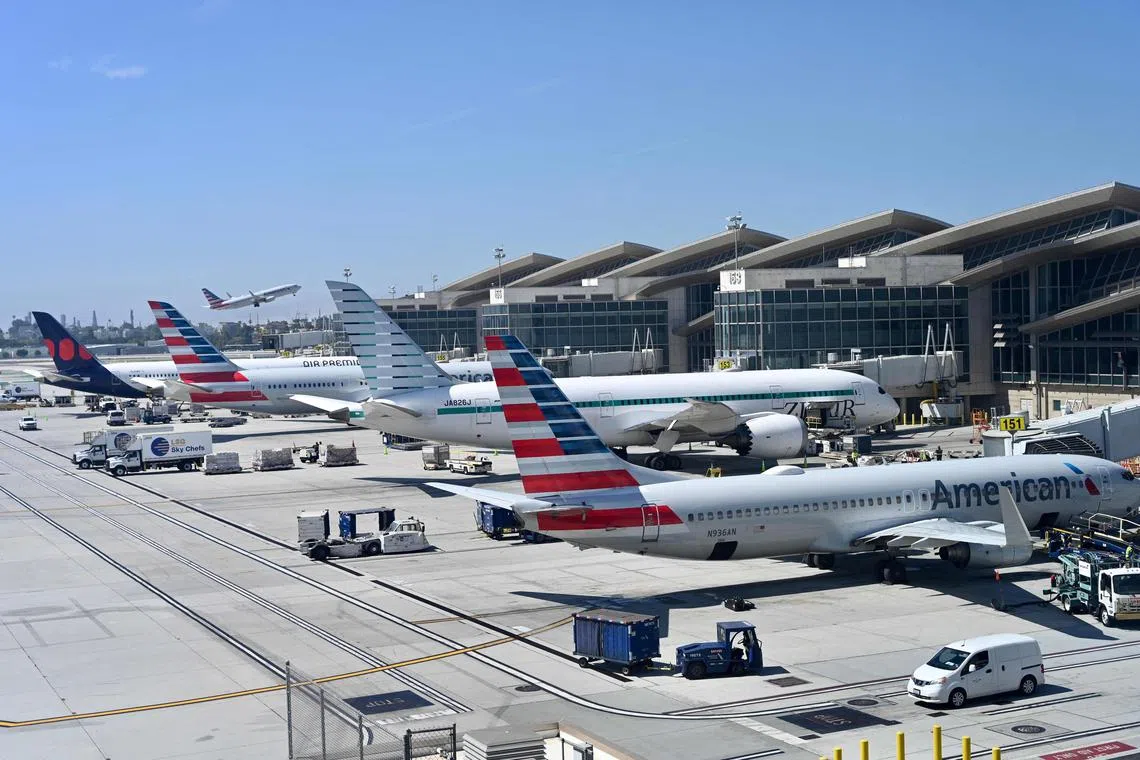A general view shows planes at Los Angeles International Airport (LAX) in Los Angeles, California, on July 26, 2023. (Photo by Daniel SLIM / AFP)