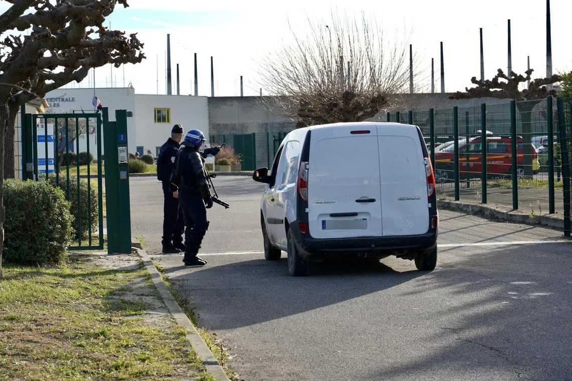 Police officers guarding the entrance of Arles prison, during the hostage situation on Jan 3.