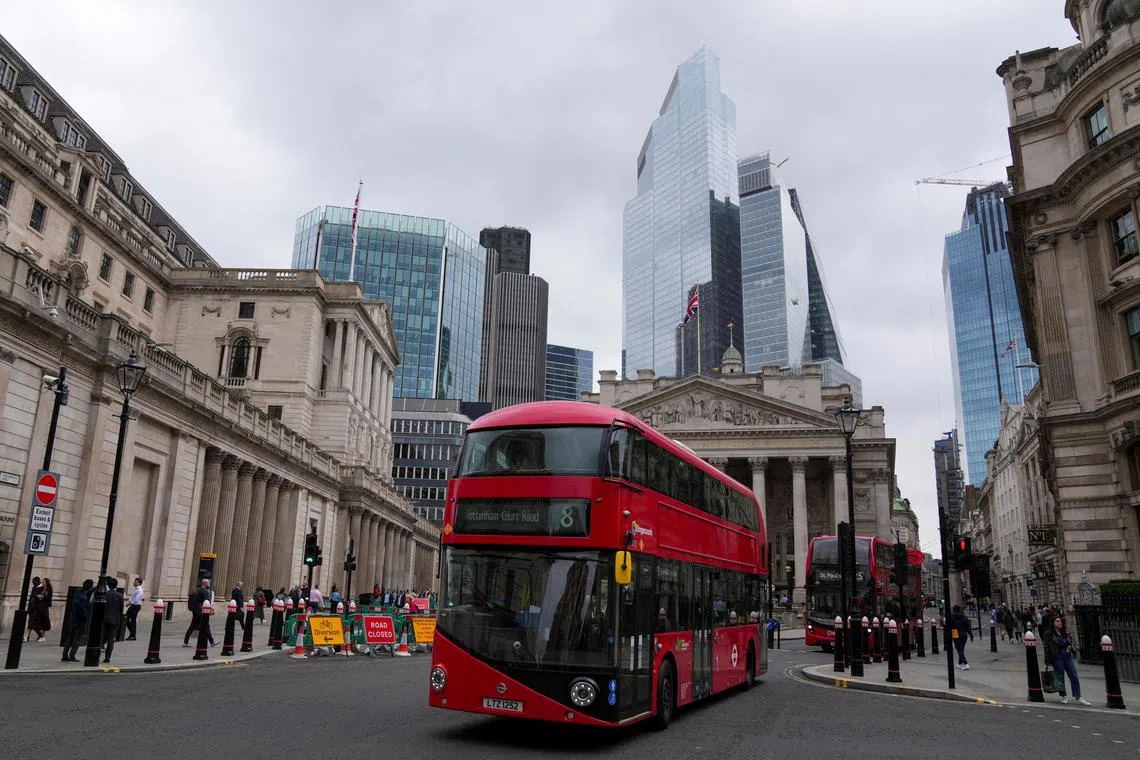 FILE PHOTO: Buses go past the Bank of England building, in London, Britain July 3, 2024. REUTERS/Maja Smiejkowska/File Photo