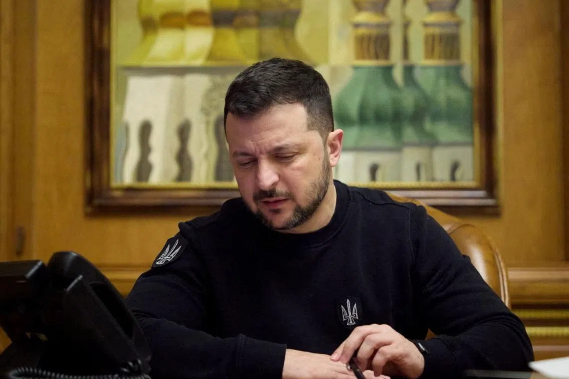 Ukraine's President Volodymyr Zelenskiy speaks on the phone with Germany's Chancellor Olaf Scholz, amid Russia's attack on Ukraine, in Kyiv, Ukraine, April 13, 2024. Ukrainian Presidential Press Service/Handout via REUTERS