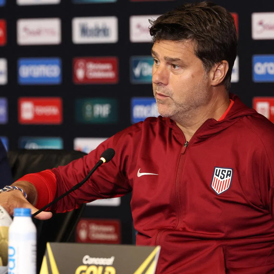 Jul 6, 2025; Houston, Texas, USA; United States head coach Mauricio Pochettino speaks to the media after the match against Mexico during the 2025 Gold Cup Final at NRG Stadium. Mandatory Credit: Troy Taormina-Imagn Images