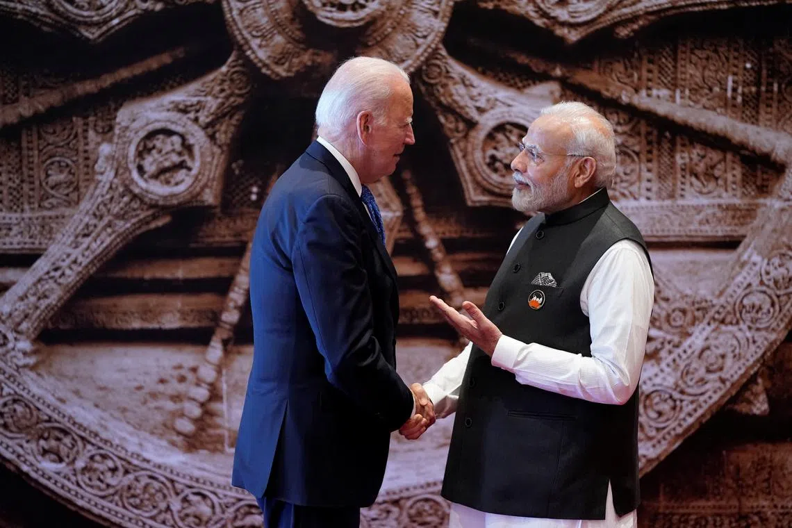 FILE PHOTO: Indian Prime Minister Narendra Modi welcomes U.S. President Joe Biden upon his arrival at Bharat Mandapam convention center for the G20 Summit, in New Delhi, India, Saturday, Sept. 9, 2023. Evan Vucci/Pool via REUTERS/File Photo