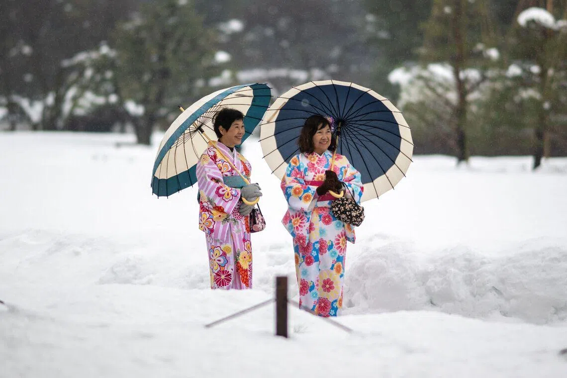 Tourists in traditional outfits visiting the snow-covered Kanazawa Castle in Kanazawa, Ishikawa Prefecture in Japan on Jan 27, 2026. 