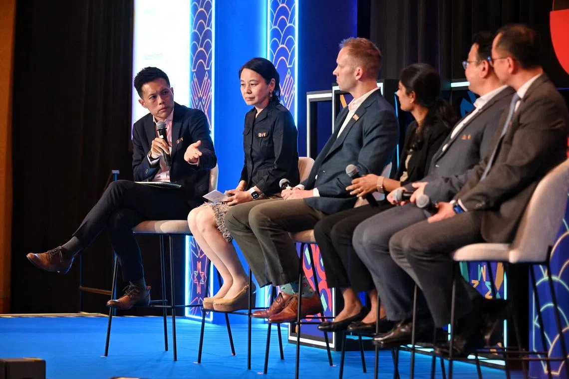 ST20241024_202449600245
Kua Chee Siong/ elgreen24/
ST Senior Transport Correspondent Lee Nian Tjoe (left) moderating a panel discussion, Unlocking the Full Potential of Electric Mobility - Challenges and Opportunities, at the roundtable on green transport, focusing on e-mobility, at the Sands Expo and Convention Centre, on Oct 24, 2024. 

From left: Naoko Doi, Senior Research Director, Assistant Director, Climate Change and Energy Efficiency Unit, The Institute of Energy Economics, Japan (IEEJ); Douglas Duncan, Head of Strategic Development, Durapower Group; Dr Dhivya Sampath Kumar, Assistant Professor, Singapore Institute of Technology; Alex Bao Zhuangfei, Head of SEA Region, Zeekr and Dean Cher, Head, SP Mobility, SP?Group.
