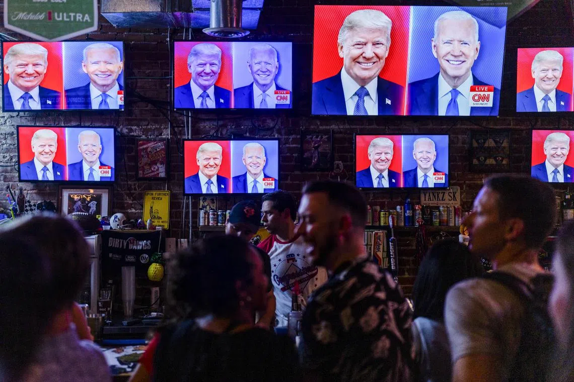 The CNN presidential debate being screened at a watch party hosted by Young Republicans at Dirty Water in Washington, on June 27, 2024.