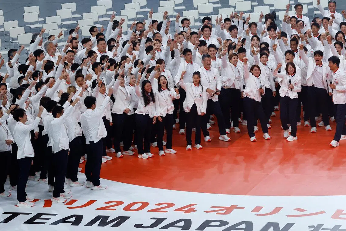 FILE PHOTO: Japan's national team's athletes gesture at a send off ceremony for the upcoming Paris 2024 Olympic Games, in Tokyo, Japan July 5, 2024. REUTERS/Kim Kyung-Hoon/File Photo