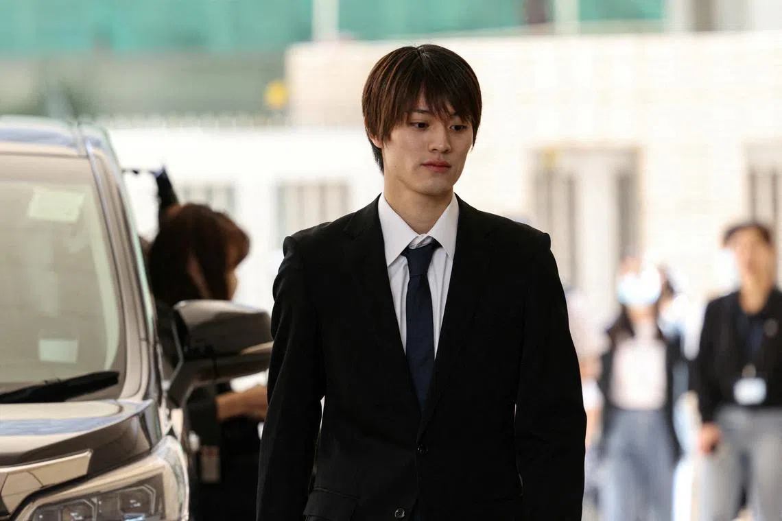 Kenshin Kamimura, a former member of the Japanese boy band ONE N' ONLY, arrives at West Kowloon Magistrates' Courts over his charge of indecent assault in Hong Kong, China, April 15, 2025. REUTERS/Tyrone Siu