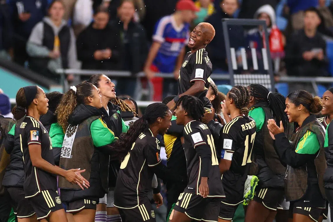 Jamaica's Deneisha Blackwood celebrating with her teammates after their first Women's World Cup point, following a draw with fifth-ranked France on Sunday.