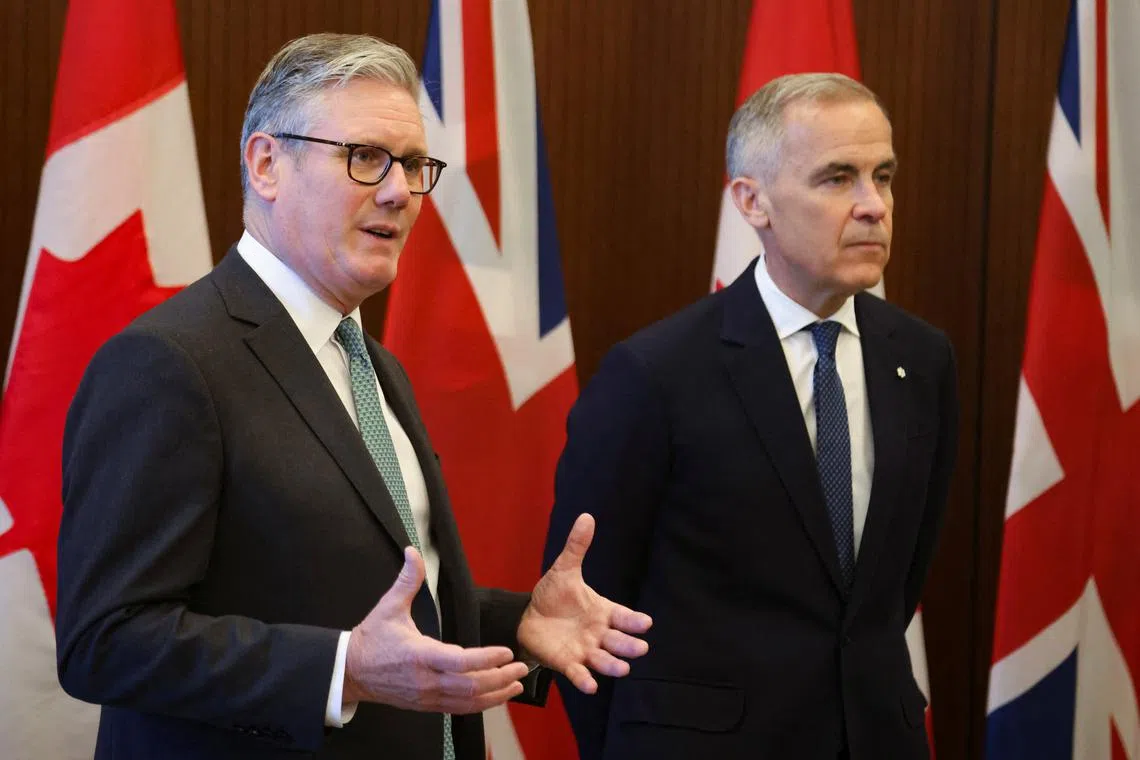 FILE PHOTO: Canada's Prime Minister Mark Carney and Britain's Prime Minister Kier Starmer meet on Parliament Hill in Ottawa, Canada, June 15, 2025.  REUTERS/Patrick Doyle/Pool/File photo