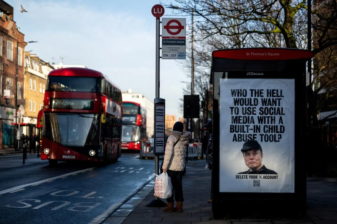 A poster calls for a boycott of Elon Musk's social media platform X, in London.